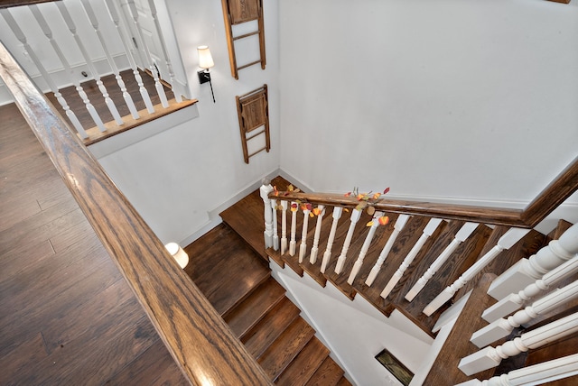 stairs featuring hardwood / wood-style flooring