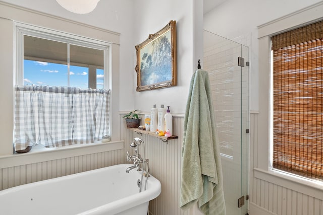 bathroom with plenty of natural light and independent shower and bath