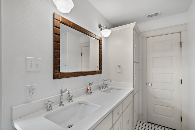 bathroom with vanity and tile patterned floors