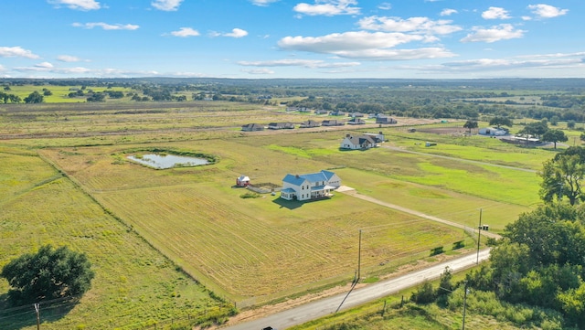 birds eye view of property featuring a rural view