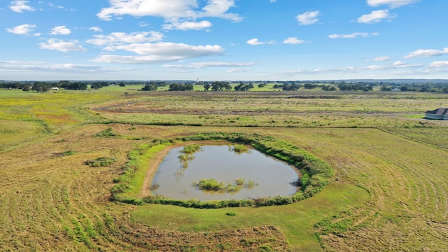 drone / aerial view featuring a water view and a rural view