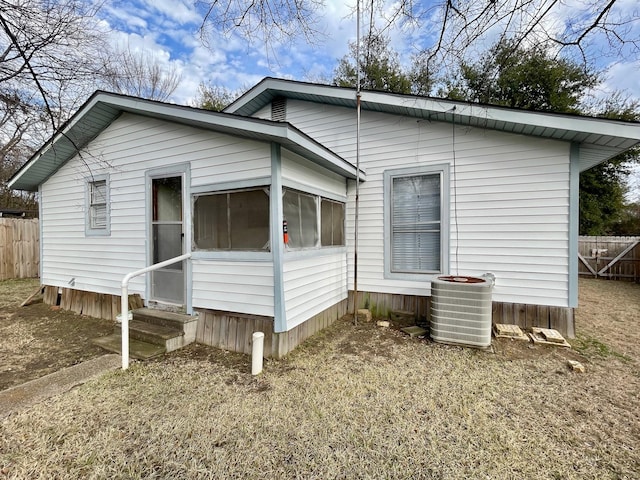 view of side of property featuring central AC unit