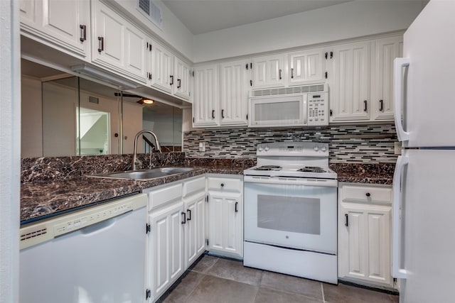 kitchen with white cabinetry, sink, white appliances, and decorative backsplash