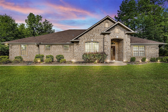 view of front of property with a yard