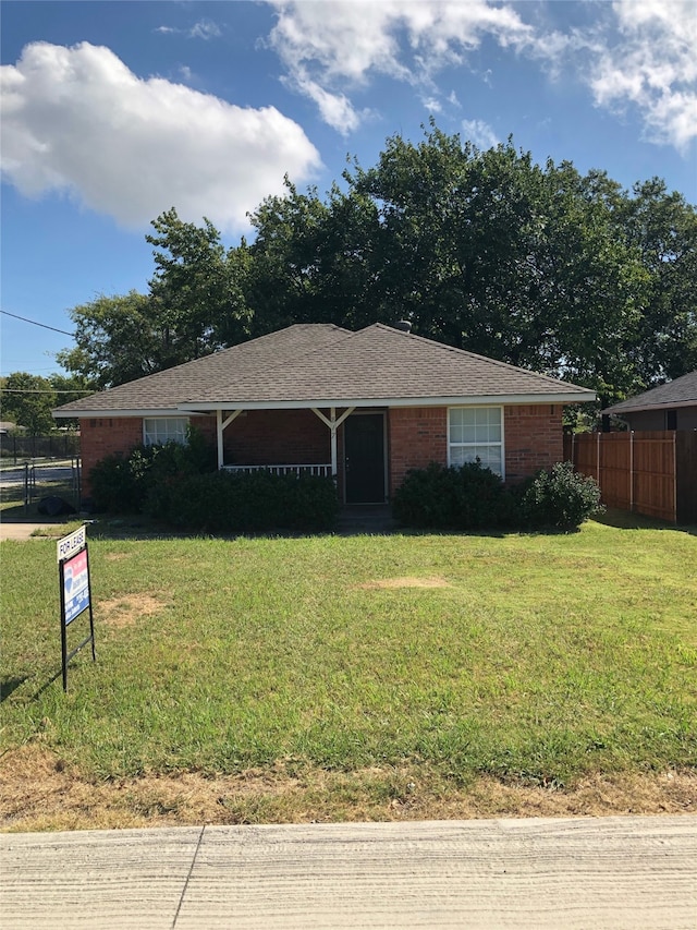 ranch-style house with a front lawn