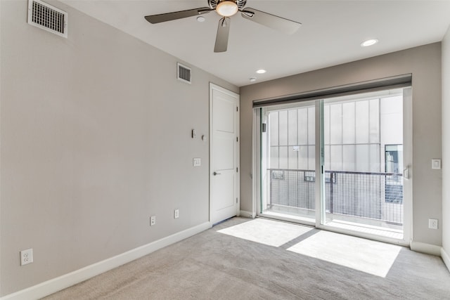 carpeted empty room with ceiling fan