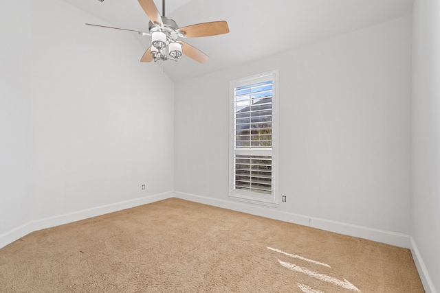 unfurnished room featuring ceiling fan, vaulted ceiling, and carpet floors