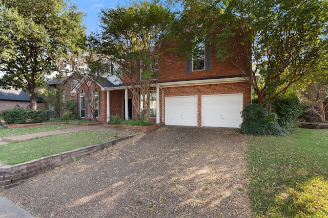 front facade featuring a garage and a front yard