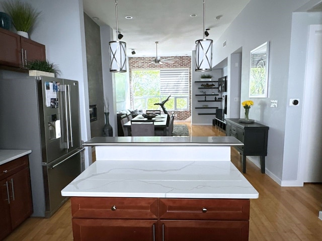 kitchen featuring a kitchen island and stainless steel fridge