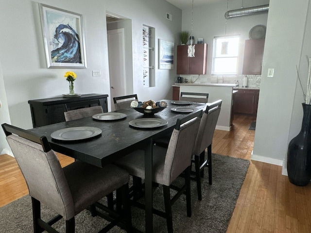 dining room with hardwood / wood-style floors