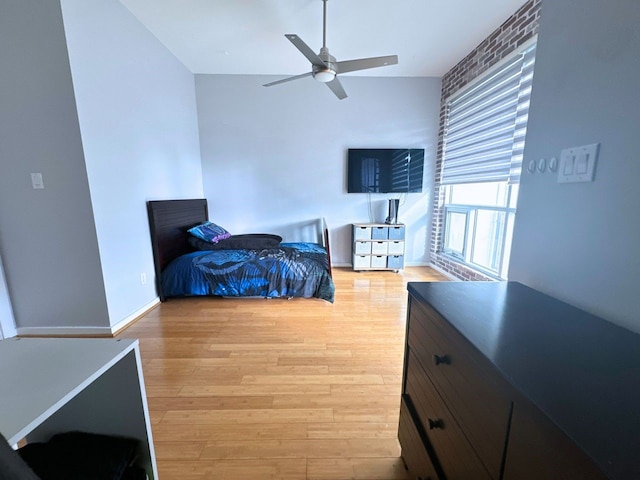 bedroom with light wood-type flooring and ceiling fan