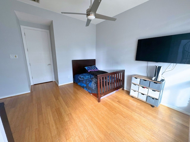 bedroom featuring ceiling fan and light hardwood / wood-style flooring