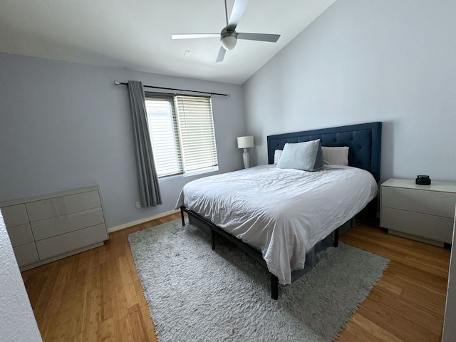 bedroom with lofted ceiling, ceiling fan, and hardwood / wood-style flooring