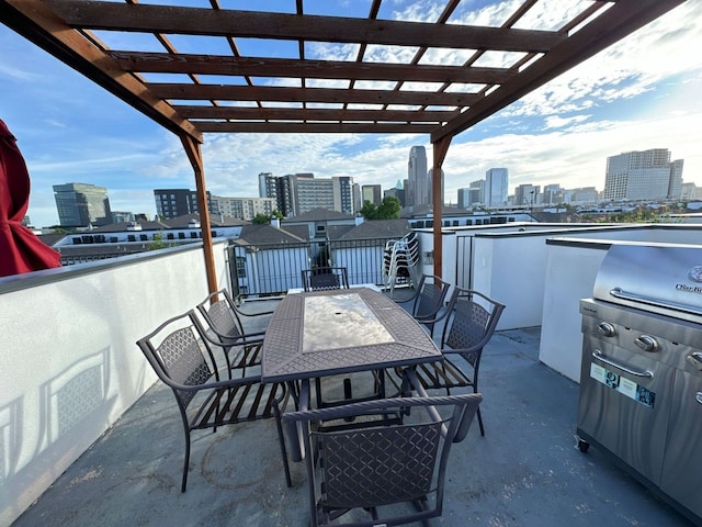 view of patio with a grill and a pergola