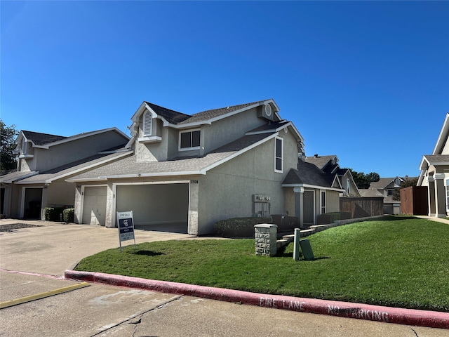 view of side of property with a yard and a garage