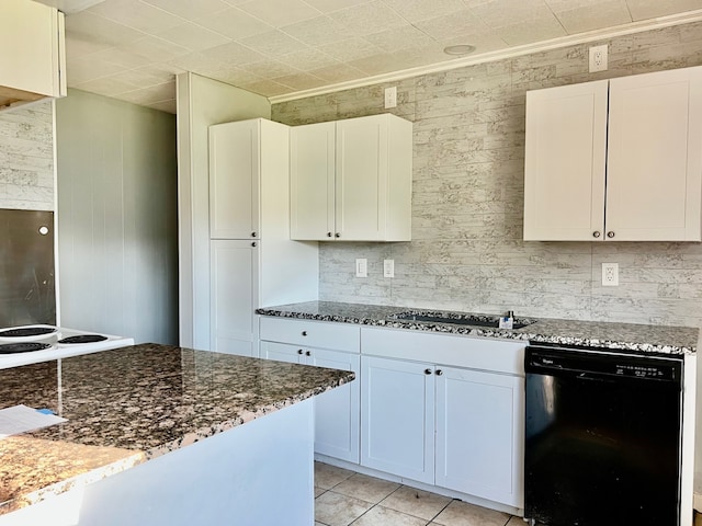 kitchen featuring dark stone countertops, white cabinets, light tile patterned floors, and black appliances