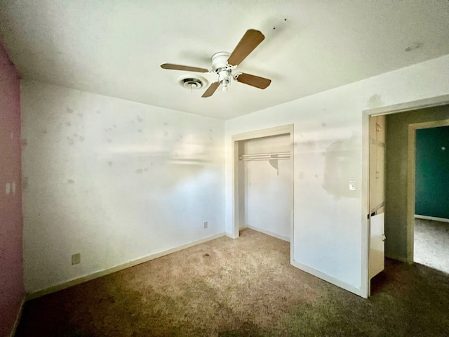 unfurnished bedroom with a closet, carpet flooring, and ceiling fan