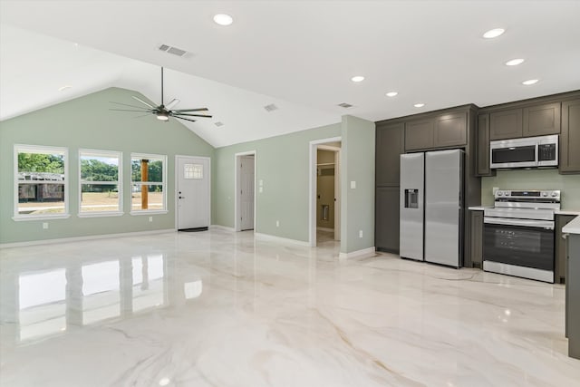 kitchen featuring appliances with stainless steel finishes, dark brown cabinets, ceiling fan, and vaulted ceiling