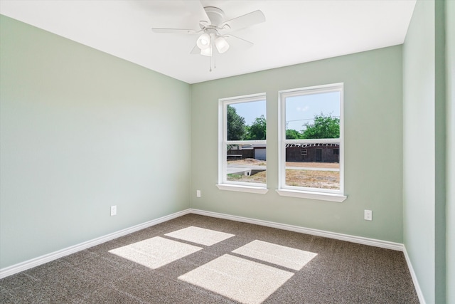 spare room featuring ceiling fan and carpet flooring