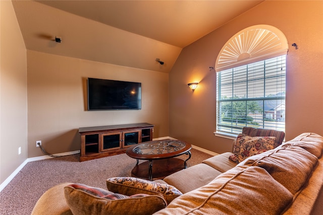 carpeted living room featuring vaulted ceiling