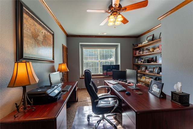 carpeted home office with ceiling fan and ornamental molding