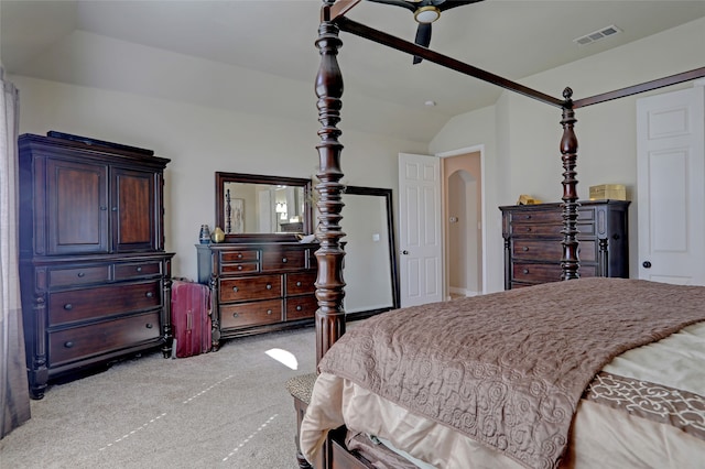 bedroom with lofted ceiling, light colored carpet, and ceiling fan