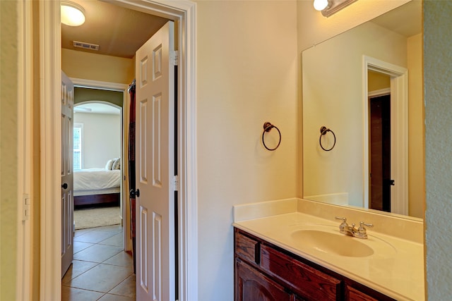 bathroom with tile patterned floors and vanity