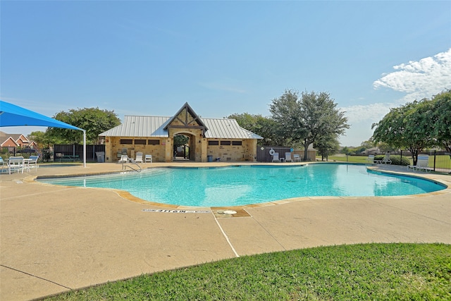 view of swimming pool with a patio area