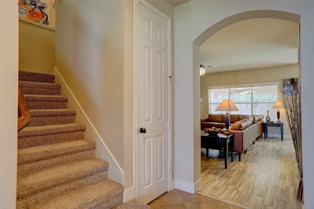 stairs featuring hardwood / wood-style flooring