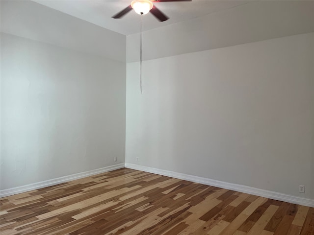 spare room with wood-type flooring and ceiling fan