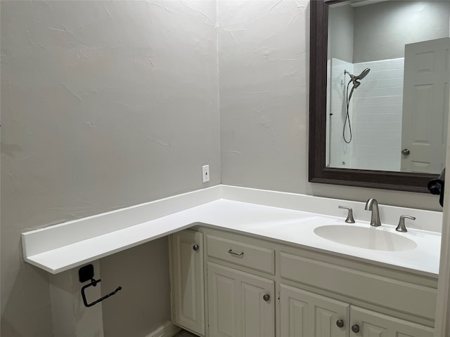 bathroom with vanity and walk in shower