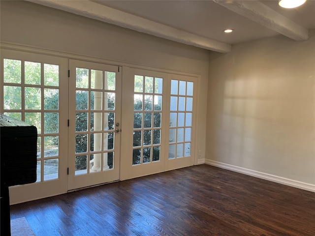 doorway with beam ceiling and dark hardwood / wood-style flooring