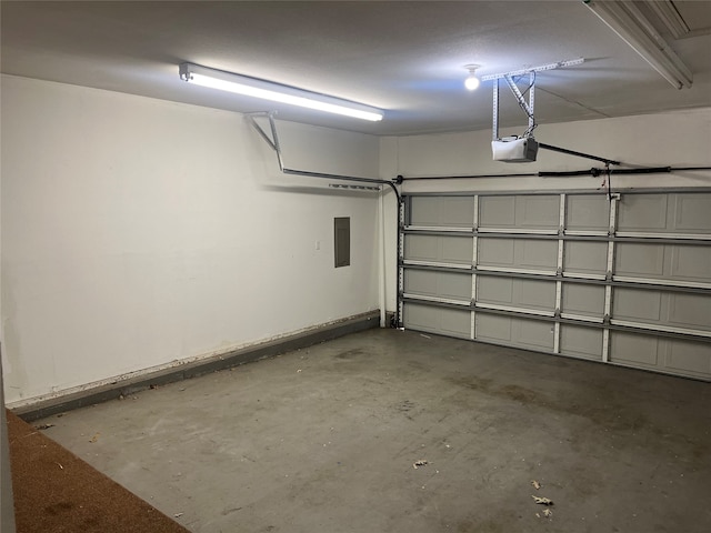 garage featuring a garage door opener and electric panel