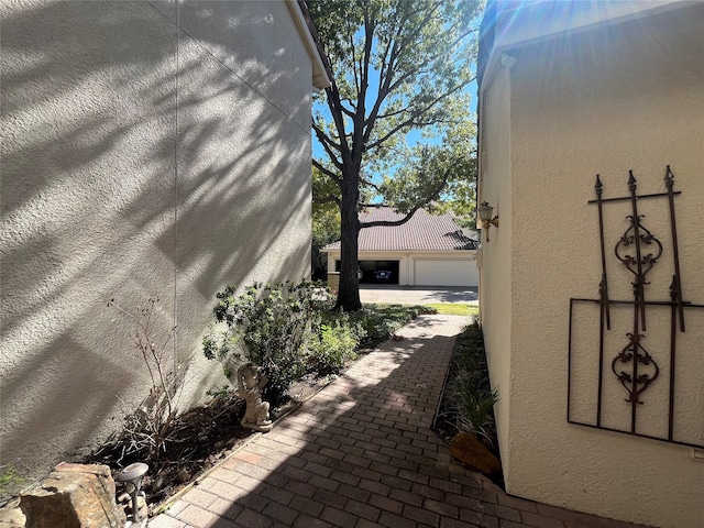 view of side of home with a garage