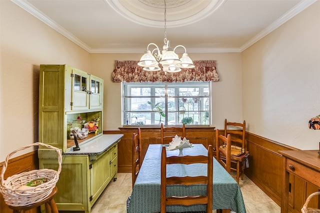 dining space featuring a notable chandelier, crown molding, and light tile patterned floors