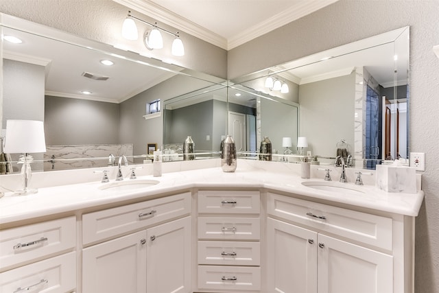 bathroom with ornamental molding and vanity