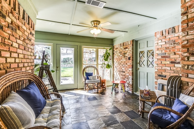 sunroom with ceiling fan