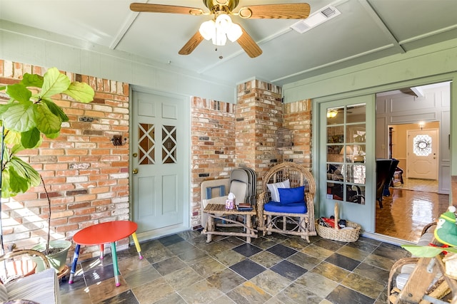 view of patio featuring ceiling fan