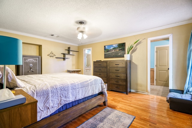 bedroom with crown molding, ceiling fan, hardwood / wood-style floors, and a textured ceiling