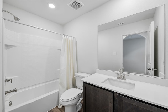 full bathroom with vanity, toilet, wood-type flooring, and shower / bath combo