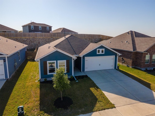 single story home with a garage and a front lawn