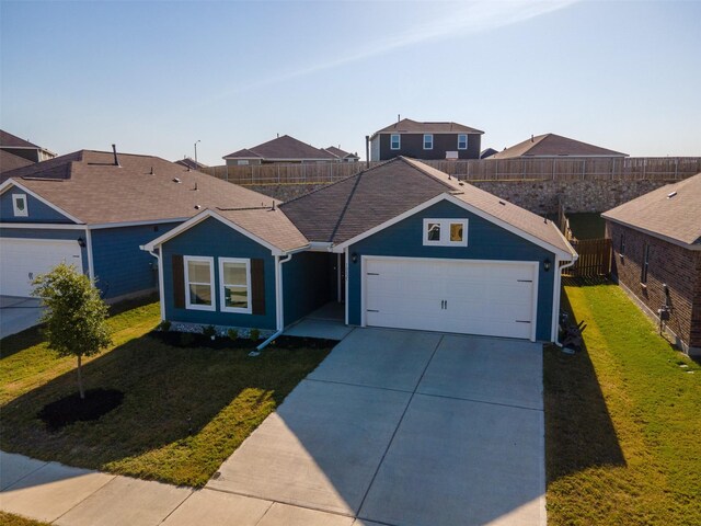 single story home with a garage and a front yard