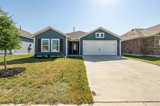 ranch-style home featuring a garage and a front lawn