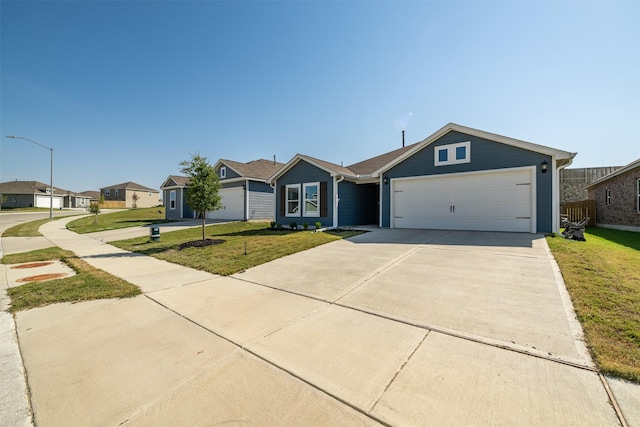 single story home featuring a garage and a front yard