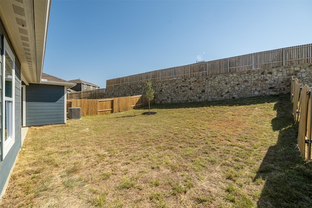 view of yard with central AC unit