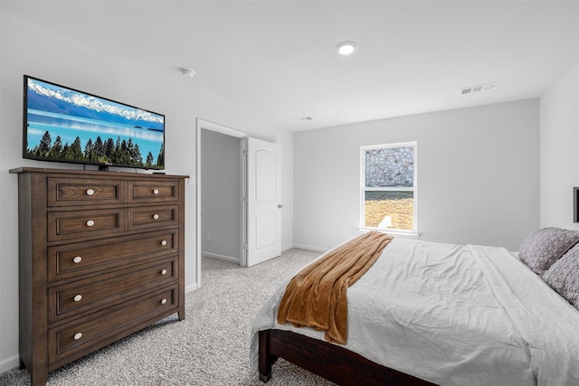 bedroom featuring light carpet