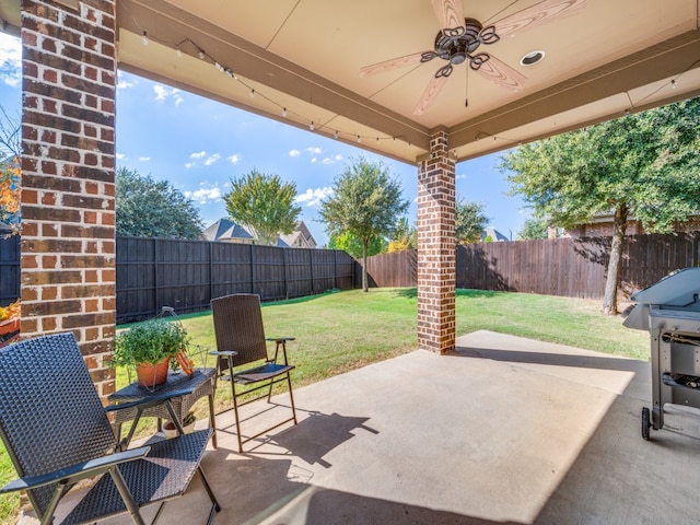 view of patio / terrace featuring ceiling fan and grilling area