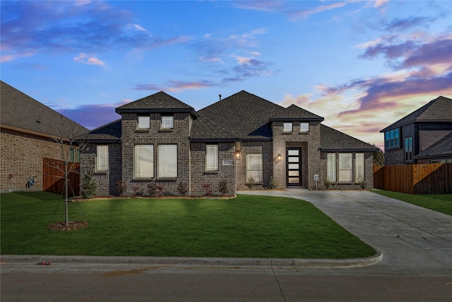 view of front of property with a lawn