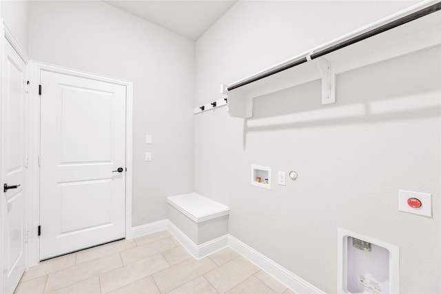 washroom featuring electric dryer hookup, hookup for a washing machine, light tile patterned floors, and gas dryer hookup