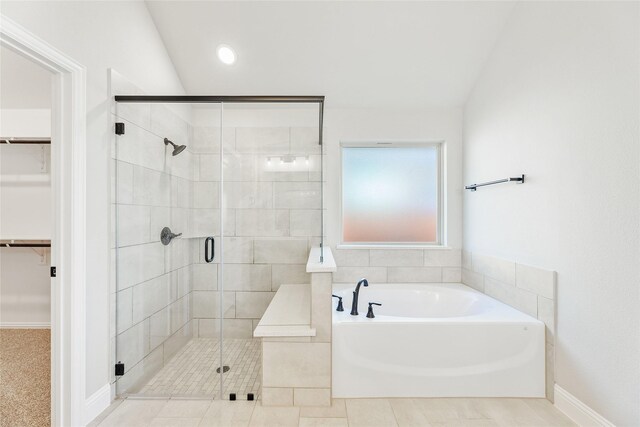 laundry area with hookup for a washing machine, hookup for a gas dryer, hookup for an electric dryer, and light tile patterned floors